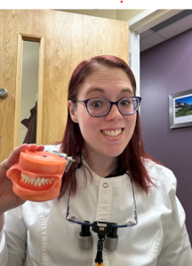 Staff member smile with teeth